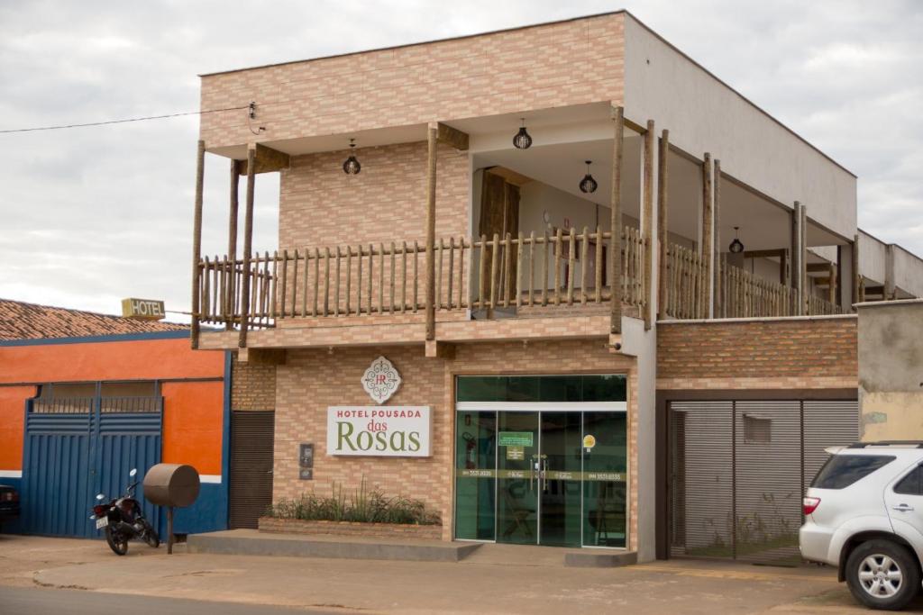 a building with a balcony on top of it at HOTEL POUSADA DAS ROSAS in Carolina