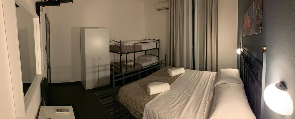 Postel nebo postele na pokoji v ubytování Hotel Neyra Beach