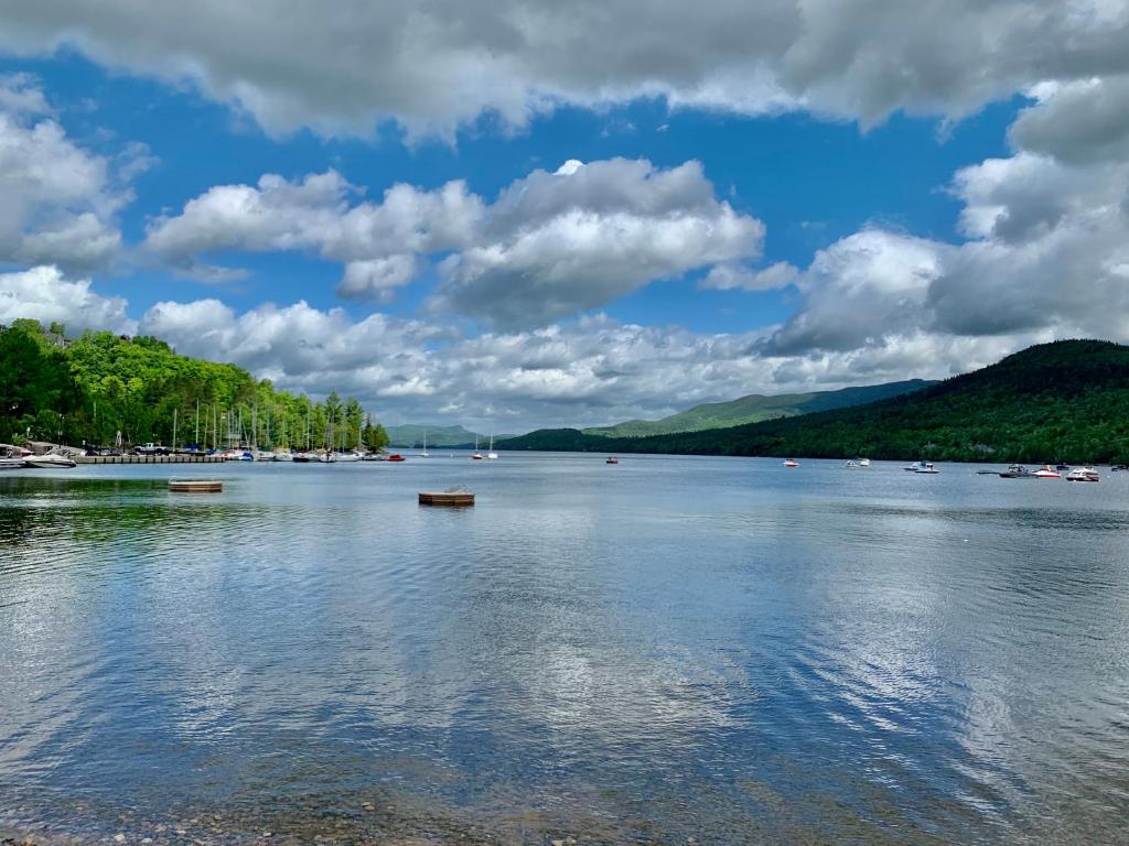 a large body of water with boats in it at Auberge Le Lupin-Self Check-in in Mont-Tremblant