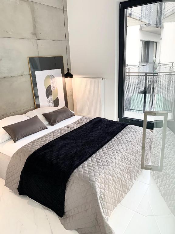 Posteľ alebo postele v izbe v ubytovaní EL Apartments - Antares