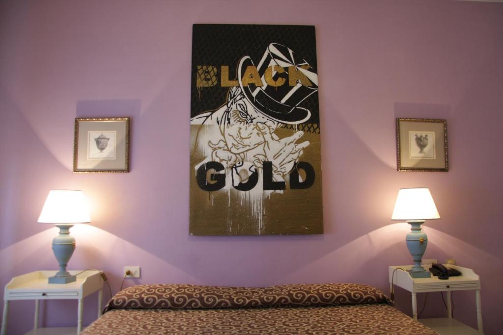 Postel nebo postele na pokoji v ubytování Hotel Alex