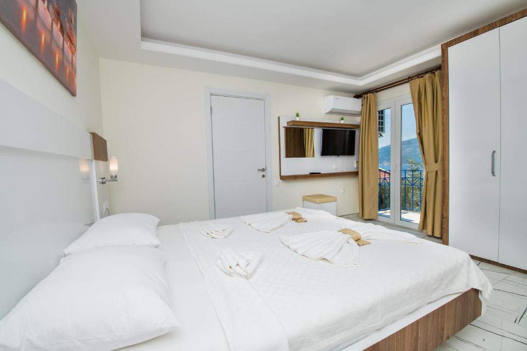 Кровать или кровати в номере Soothe Hotel