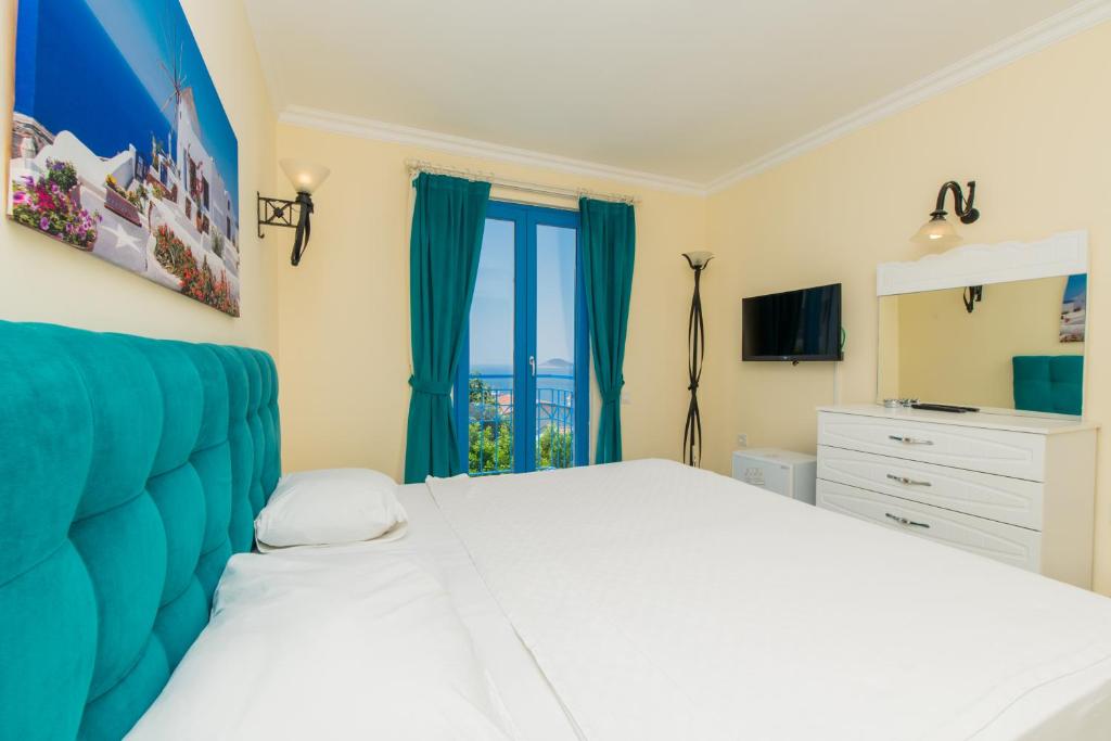 Кровать или кровати в номере Soothe Hotel