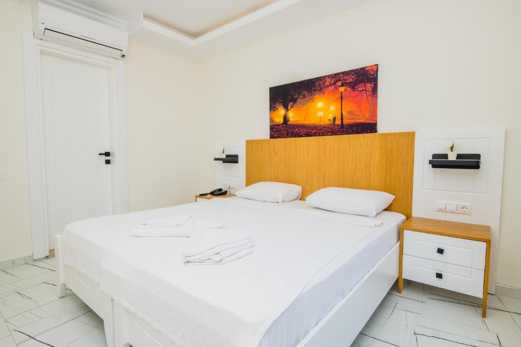 Кровать или кровати в номере Soothe Hotel