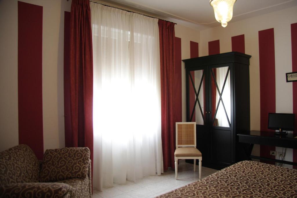 Postel nebo postele na pokoji v ubytování Hotel Alex