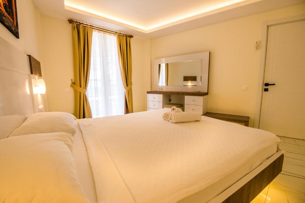 Кровать или кровати в номере Soothe Hotel
