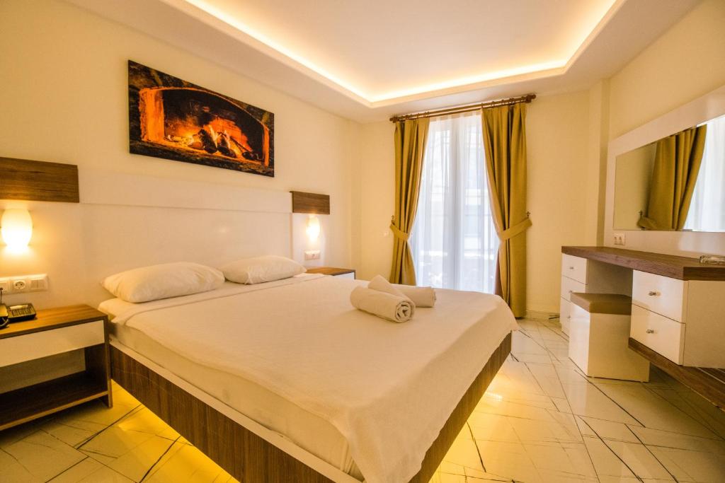 Кровать или кровати в номере Soothe Hotel