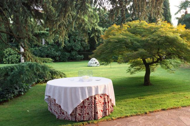 a table with a white table cloth on top of a field at Hotel Due Mori in Cittadella