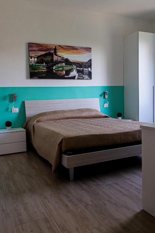 Postel nebo postele na pokoji v ubytování Lorenteggio 209