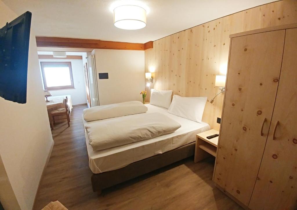 Postel nebo postele na pokoji v ubytování Garni Gabrieli