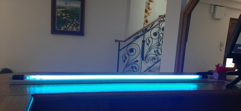 a staircase with blue lights next to a stair case at Vila pe plaja nr 9 in Saturn