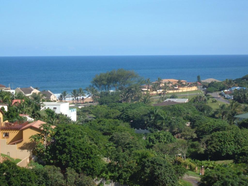 a view of a town with the ocean in the background at Zuider Zee Guest House in Ballito