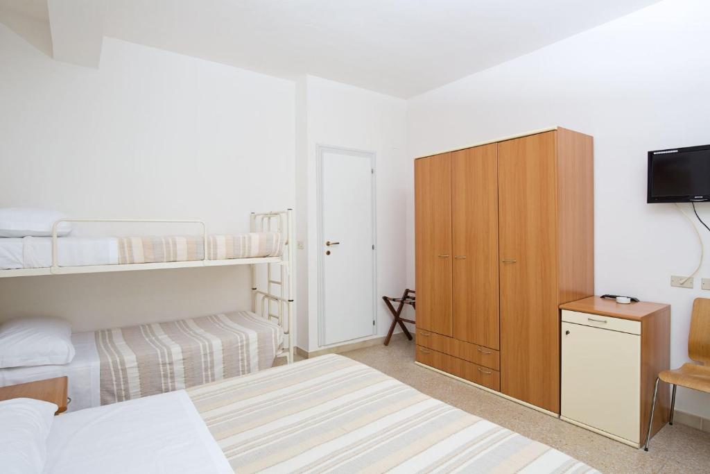 Postel nebo postele na pokoji v ubytování Hotel Helios
