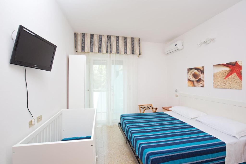 Postel nebo postele na pokoji v ubytování Hotel Helios