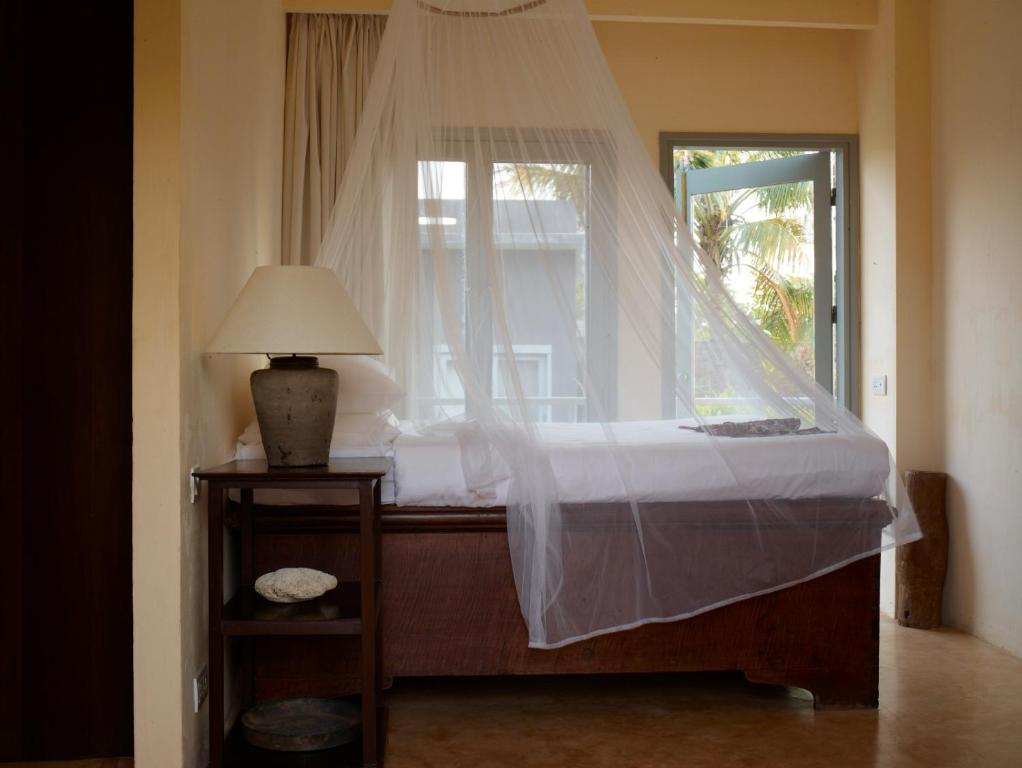 Postel nebo postele na pokoji v ubytování Knai Bang Chatt Resort
