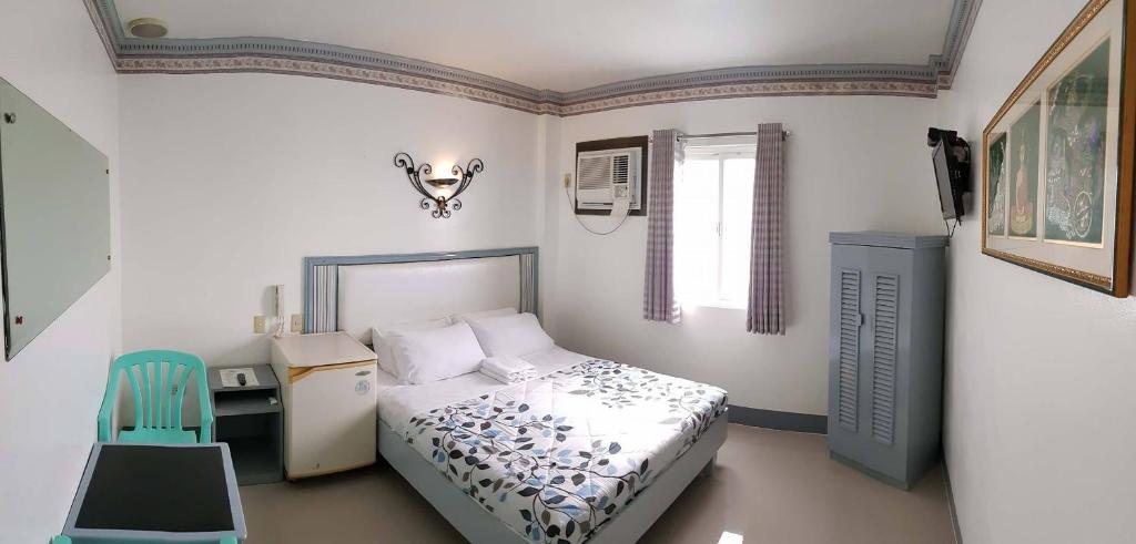 Postel nebo postele na pokoji v ubytování SM Travelodge