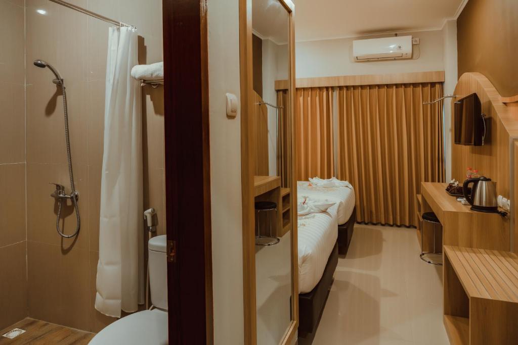 Postel nebo postele na pokoji v ubytování panfila hotel