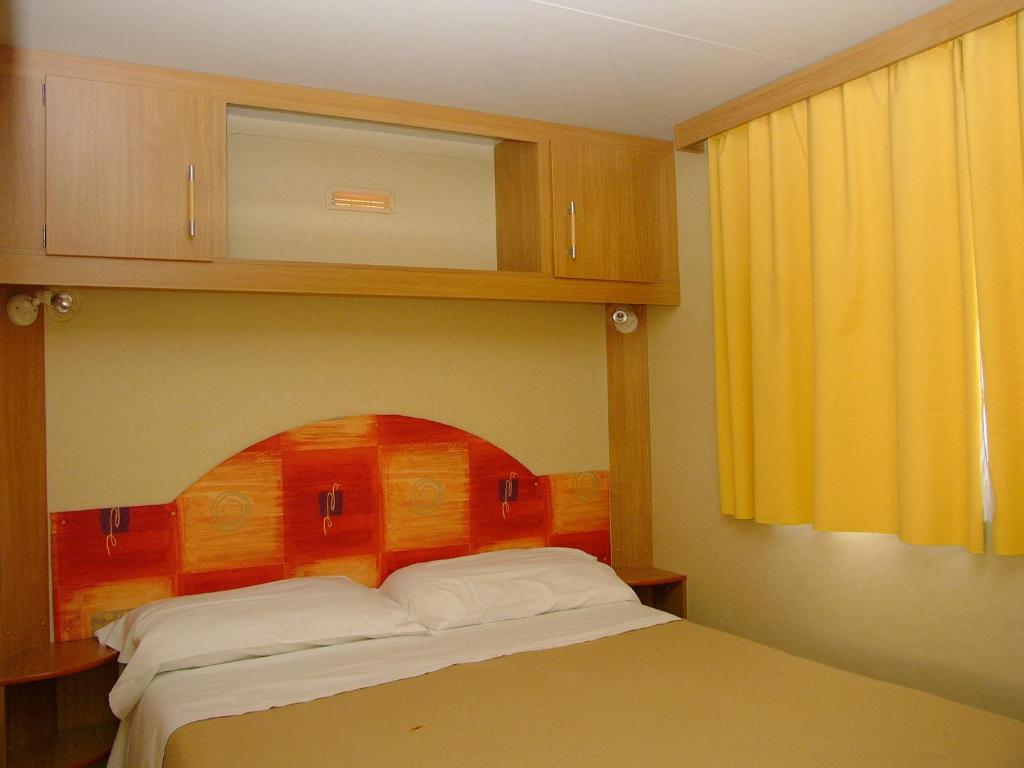 Postel nebo postele na pokoji v ubytování Camping Costa Ponente
