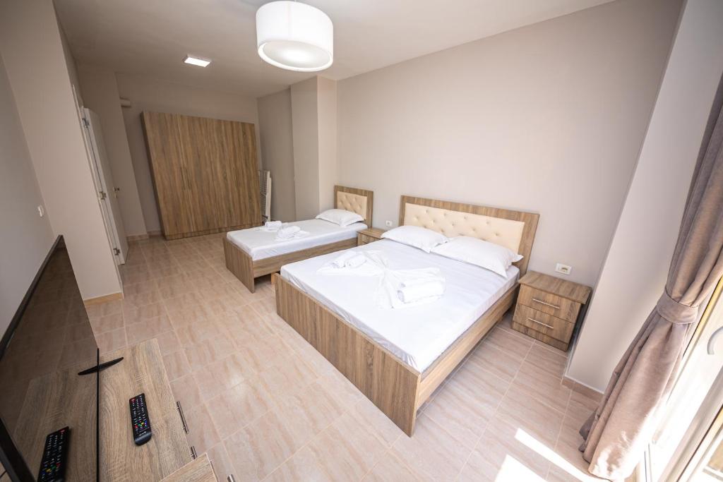 Postel nebo postele na pokoji v ubytování Ponari S Hotel