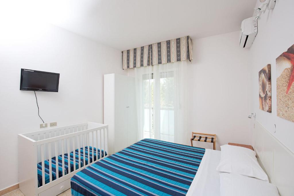 Postel nebo postele na pokoji v ubytování Hotel Helios