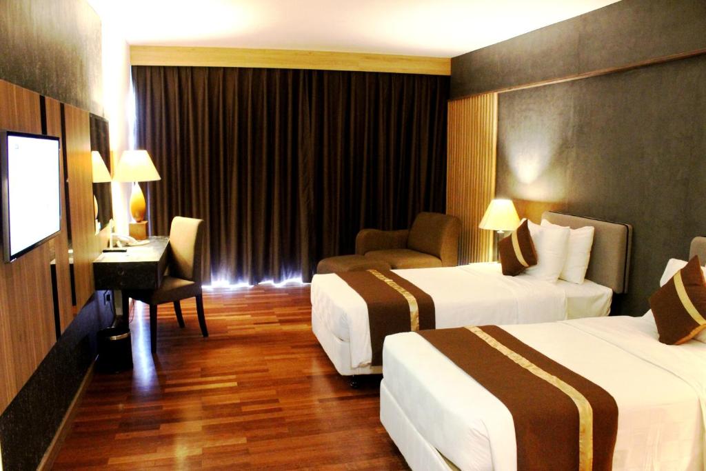 Postel nebo postele na pokoji v ubytování Batam View Beach Resort