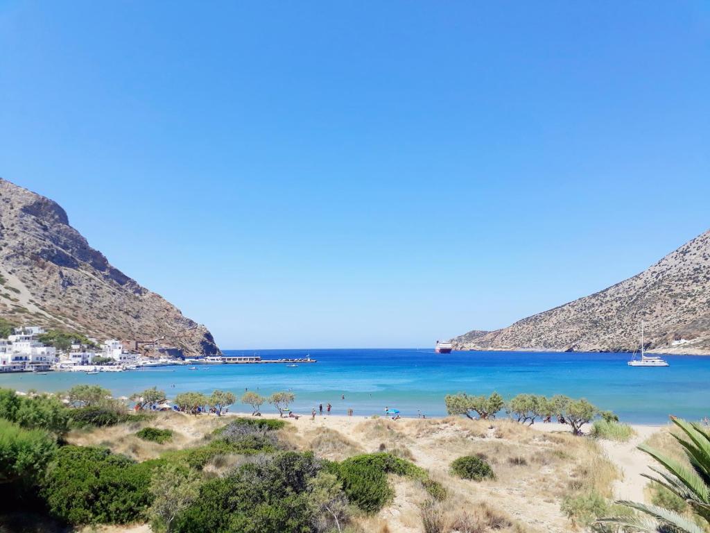 a view of a beach with mountains in the background at Hotel Boulis in Kamarai