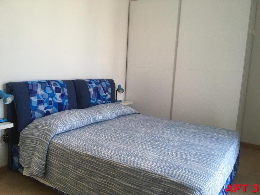 A bed or beds in a room at Agnese Apartments
