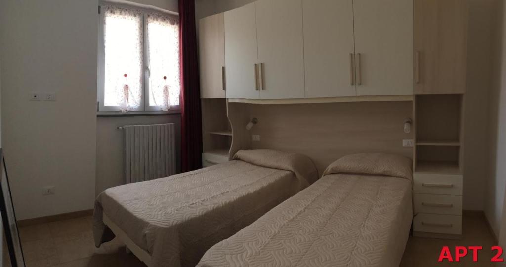 A bed or beds in a room at Agnese Apartments