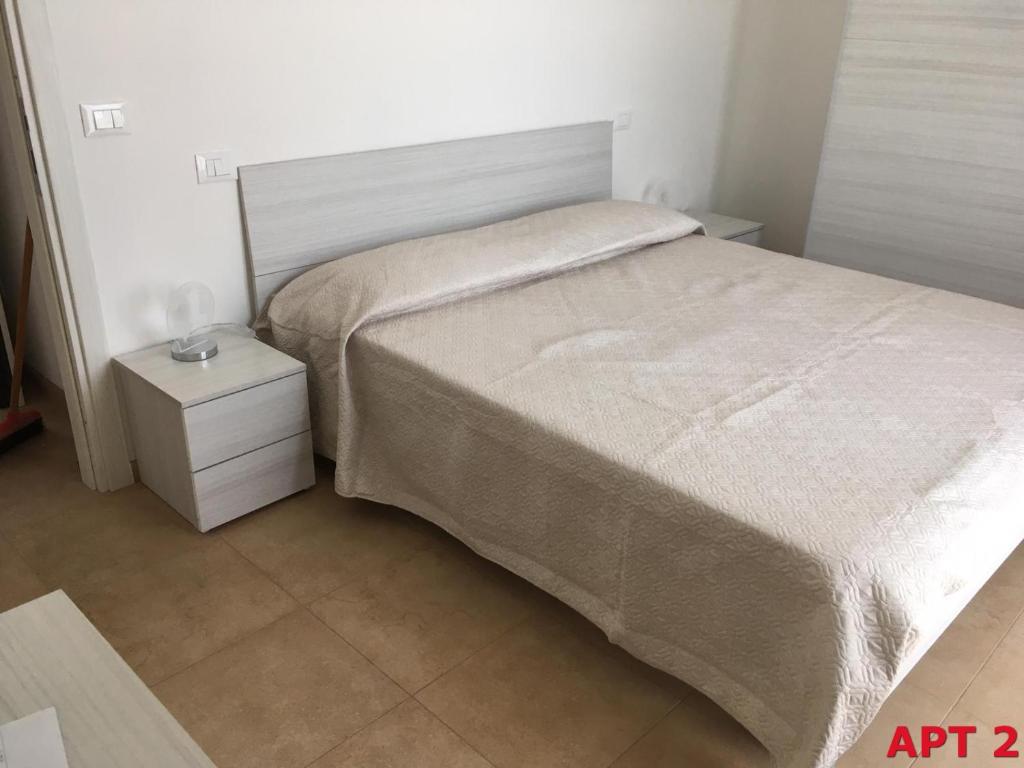 A bed or beds in a room at Agnese Apartments