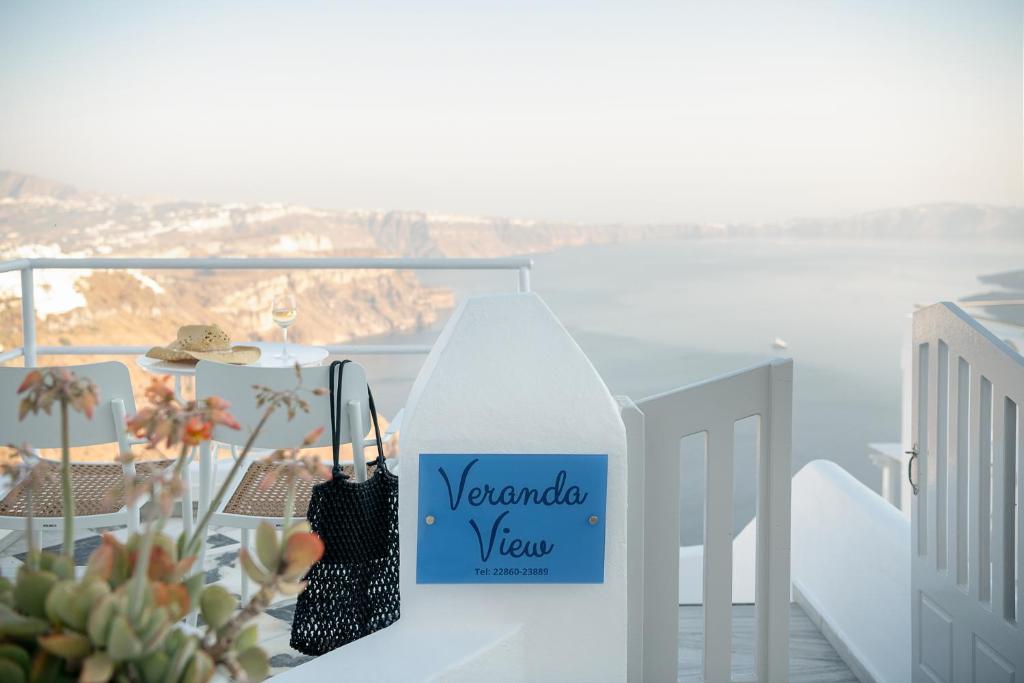 a sign that says vendarado view sitting on a balcony at Veranda View in Imerovigli