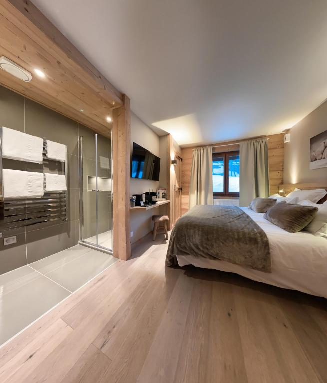 Кровать или кровати в номере Hotel Les Flocons