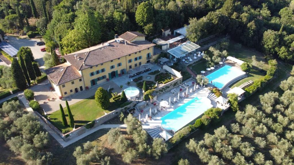 an aerial view of a house with a swimming pool at Palagina la dimora in Figline Valdarno