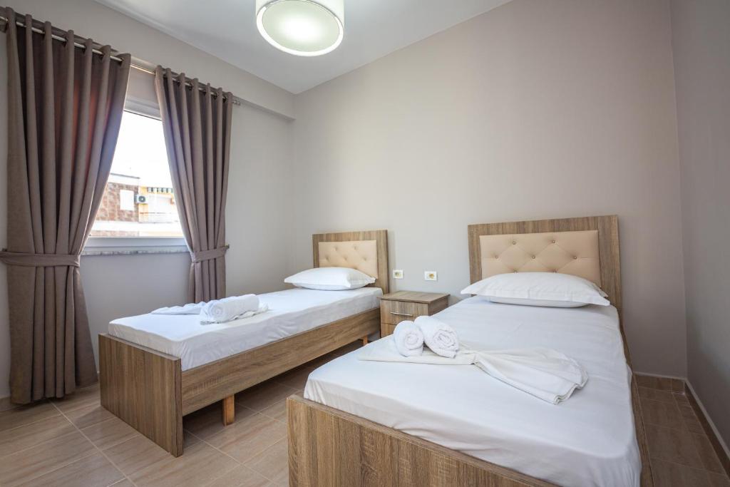 Postel nebo postele na pokoji v ubytování Ponari S Hotel