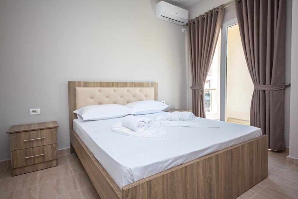 Postel nebo postele na pokoji v ubytování Ponari S Hotel
