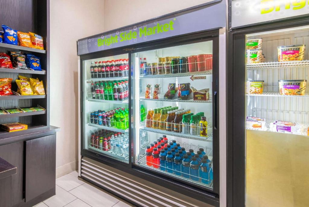 a refrigerator filled with lots of different types of drinks at Holiday Inn Express & Suites - Ardmore by IHG in Ardmore