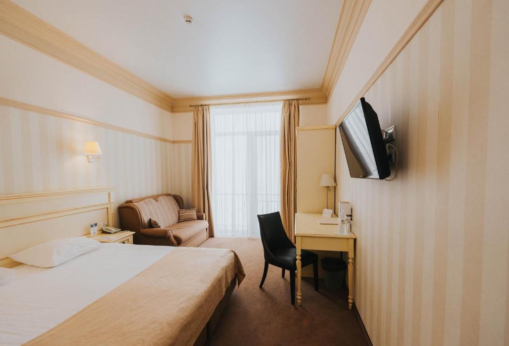 Postel nebo postele na pokoji v ubytování Premier Geneva Hotel