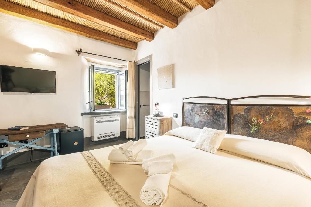 Postel nebo postele na pokoji v ubytování Sa Crai B&B - Sardinian Experience