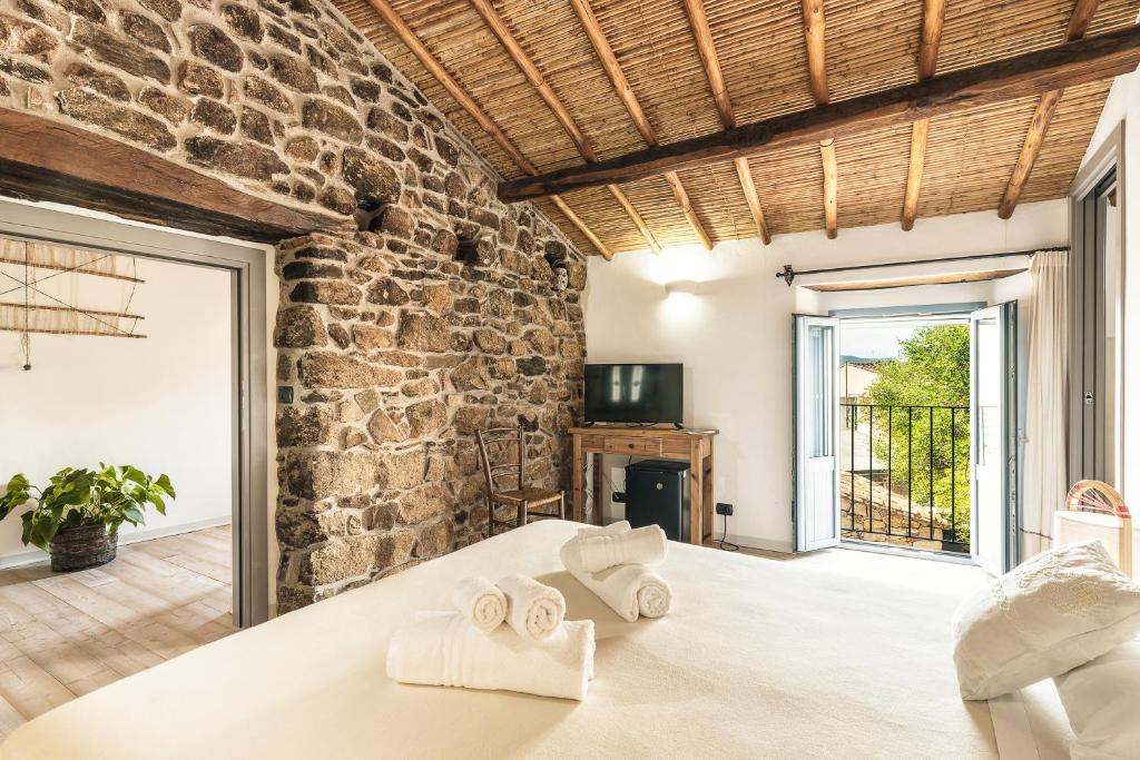 Postel nebo postele na pokoji v ubytování Sa Crai B&B - Sardinian Experience