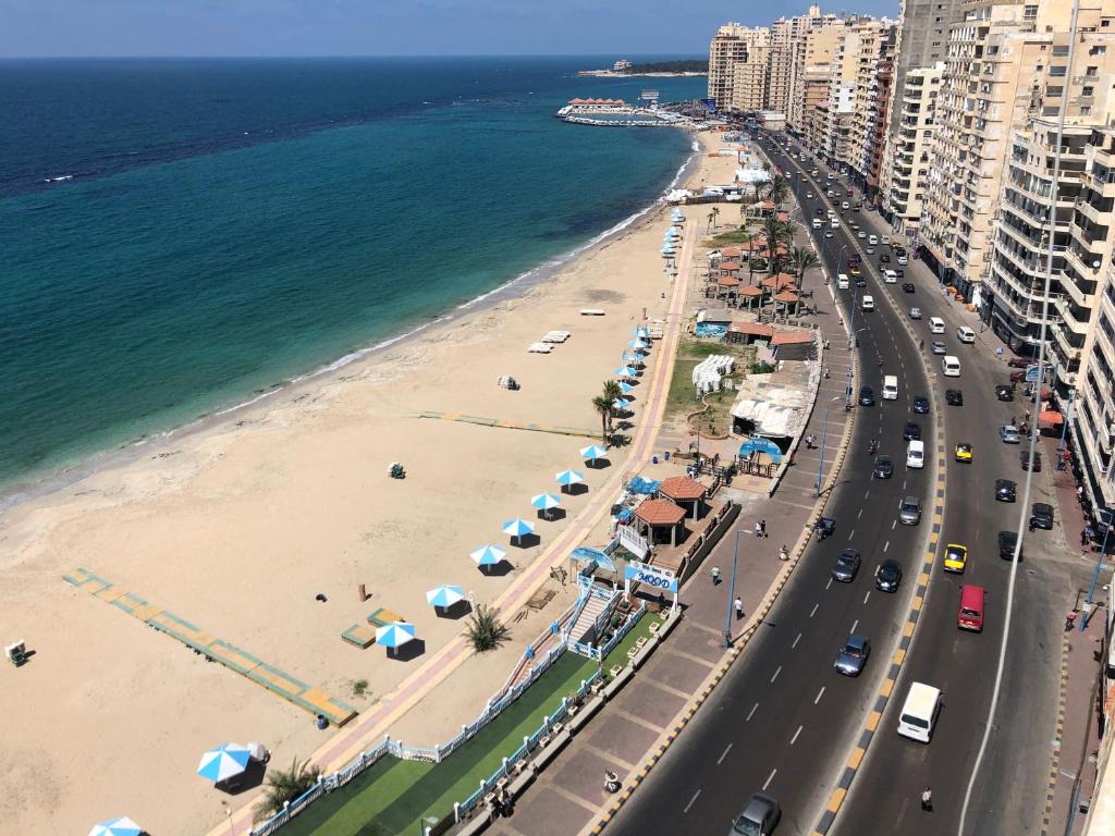 an aerial view of a beach with umbrellas at ZAFERO POREFAG- Families only in Alexandria