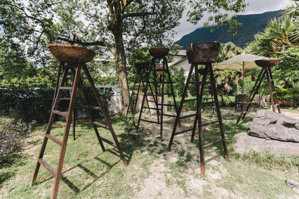 a group of ladders with baskets on top of them at Monet Garden Coffee Farm in Chinan