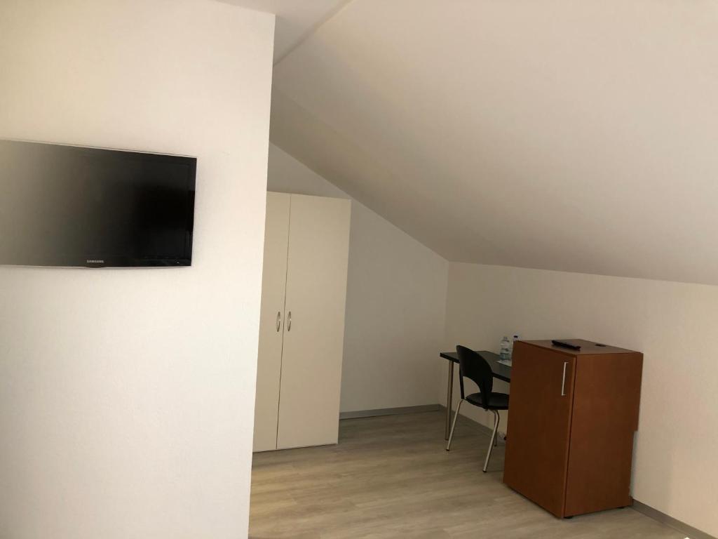 TV a/nebo společenská místnost v ubytování Hotel Restaurant Passage
