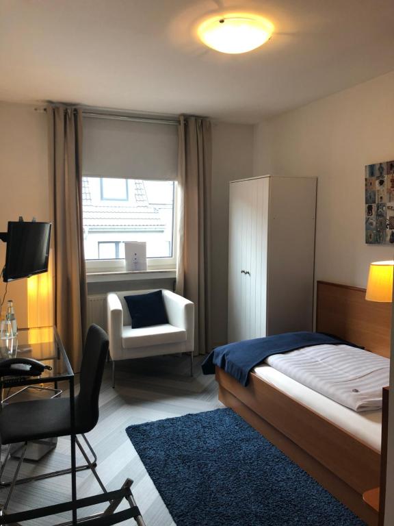 Postel nebo postele na pokoji v ubytování bensons hotel