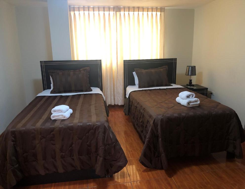 Postel nebo postele na pokoji v ubytování B&B Cusing Wasi