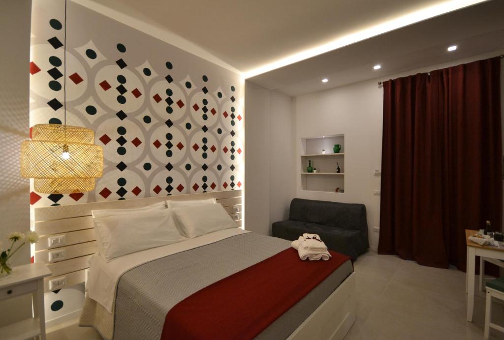 Postel nebo postele na pokoji v ubytování B&B Donna Marisa