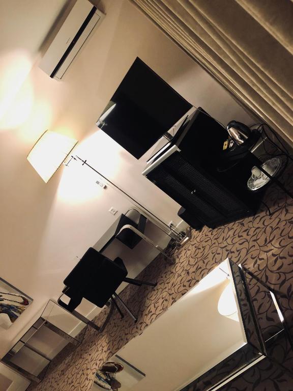 TV a/nebo společenská místnost v ubytování Hotel Adriatica