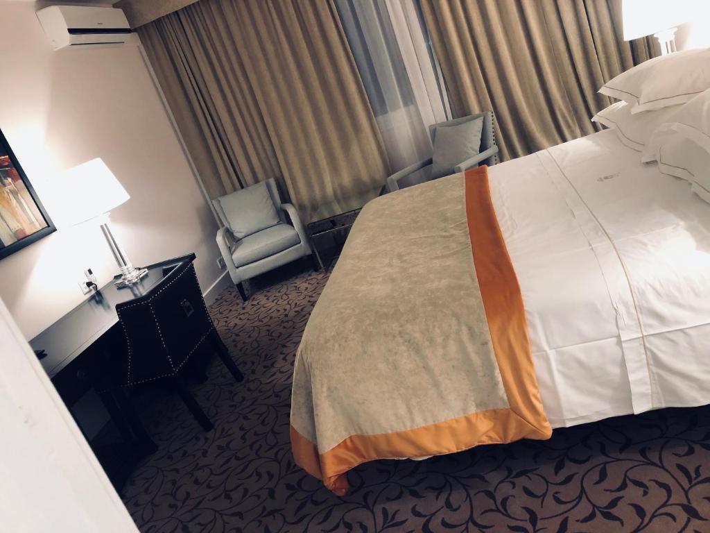 Postel nebo postele na pokoji v ubytování Hotel Adriatica