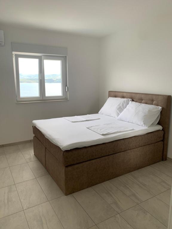 Postel nebo postele na pokoji v ubytování Elona Apartments