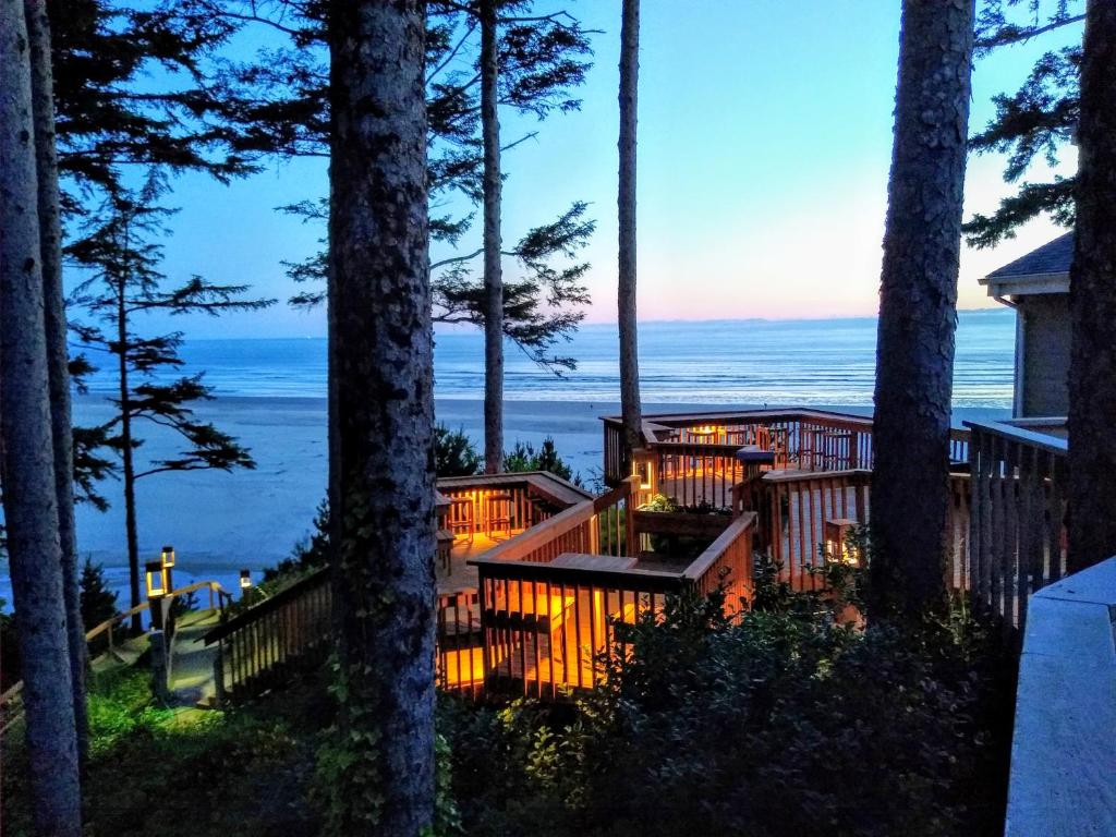 a house with a deck with a view of the ocean at Starfish Point in Newport