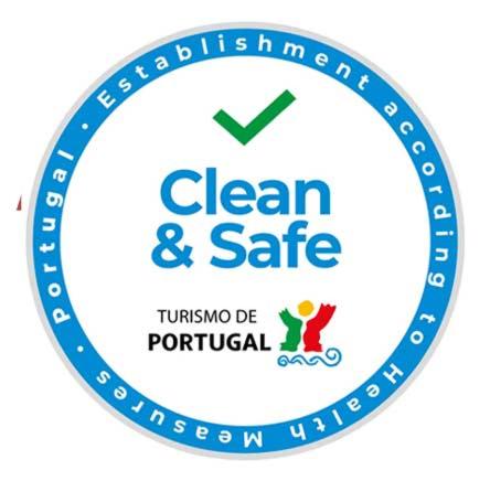 a blue clean and safe logo in a circle at AQC - A Quinta Chama in Caldas da Rainha