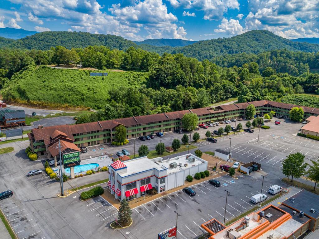 an aerial view of a building with a parking lot at Days Inn By Wyndham Pigeon Forge South in Pigeon Forge